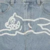 Pantalones vaqueros de doble bolsillo con el perro corriendo