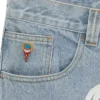 Pantalones vaqueros de doble bolsillo con el perro corriendo